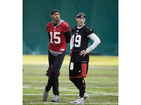 The Calgary Stampeders Eric Rogers and Bo Levi Mitchell watch a play during practice in preparation for the Grey Cup earlier this week in Edmonton.