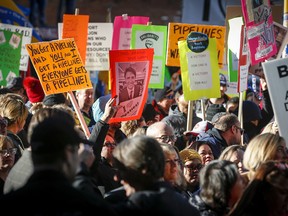 Protesters outside an event Prime Minister Justin Trudeau is attending in Calgary on Thursday, Nov. 22, 2018.