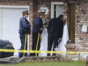 Police investigate the suspicious death of a woman at a home on Colborne Street in Burnaby in March 2009. The victim was later identified as Kimberly Hallgarth, an ex-girlfriend of football prospect Josh Boden.