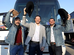 Calgary Stampeders (left to right) Eric Mezzalira, Alex Singleton and Rene Paredes prepare to board the bus to Edmonton on Tuesday, Nov. 20, 2018.