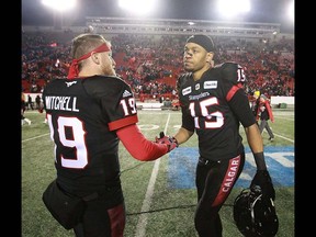 Calgary Stampeders QB Bo Levi Mitchell and Eric Rogers celebrate after the CFL Western Final in Calgary at McMahon Stadium on Sunday, November 18, 2018. Jim Wells/Postmedia