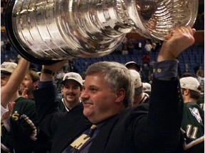 FILE - In this June 20, 1999, file photo, Dallas Stars coach Ken Hitchcock hoists the Stanley Cup after the Stars defeated the Buffalo Sabres 2-1 in triple overtime in Game 6 of the Stanley Cup finals in Buffalo, N.Y. Stars coach Ken Hitchcock is retiring, ending a 22-year career as the third-winningest coach in NHL history. Hitchcock will become a consultant for the team he led to its only Stanley Cup championship in 1999. (Ryan Remiorz/The Canadian Press via AP, File) ORG XMIT: NY161