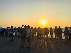 An image of people gathered near Mallory Square for the Key West Sunset Celebration
