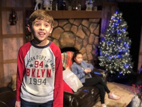 Kelden Christensen with Peniel Negre in the background in rehearsals for StoryBook Theatre's T'was the Night Before Christmas.