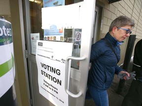 A resident leaves the Olympic plebiscite voting station at Renfrew Community Association on Tuesday, Nov. 13, 2018.