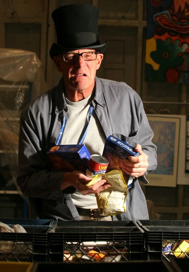 2008: Actor Stephen Hair who plays Scrooge in Theatre Calgary's A Christmas Caol helps fill food hampers at the Calgary Food Bank.