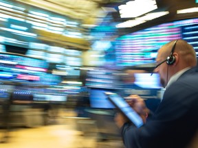 Traders work on the floor at the opening bell of the Dow Industrial Average at the New York Stock Exchange on August 22, 2018 in New York. - Wall Street was poised Wednesday to observe the longest-ever "bull market," a run that began amid extraordinary crisis-era monetary policy and which experts think could persist at least a while longer.The record will be set at Wednesday's close when the S&P 500 ends its 3,453rd straight session without a drop of 20 percent. (Photo by Bryan R. Smith / AFP)BRYAN R. SMITH/AFP/Getty Images