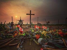 This picture, shot in late August, captures an eerie evening near Nipawin, Sask., at the road-side memorial of the Humboldt Broncos' bus crash. With smoke from the B.C. forest fires dimming the sunset, it created a moody atmosphere as Broncos were about to open their 2018 training camp.  Leah Hennel/Postmedia