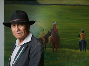 Roland Rollinmud, from the Stoney Nakoda Nation and his mural at the new Central  Library in Calgary, Ab., on Tuesday October 30, 2018. Leah Hennel/Postmedia