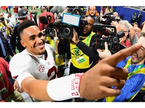 Jalen Hurts #2 of the Alabama Crimson Tide reacts after defeating the Georgia Bulldogs 35-28 in the 2018 SEC Championship Game at Mercedes-Benz Stadium on Saturday in Atlanta.
