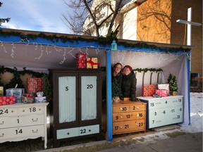 Sheri Bolitho, left and Charlotte Petti and  with the life-sized advent calendar at Woodcliff United Church in Calgary, on Thursday December 13, 2018.