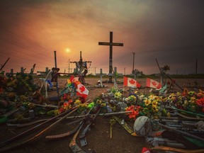 This picture, shot in late August, captures an eerie evening near Nipawin, Sask., at the road-side memorial of the Humboldt Broncos' bus crash. With smoke from the B.C. forest fires dimming the sunset, it created a moody atmosphere as Broncos were about to open their 2018 training camp.  Leah Hennel/Postmedia