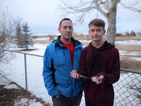 Anton English and his son Ethan, 16, tried to stop a coyote from killing their dog Jaks outside their home in Airdrie. Leah Hennel/Postmedia