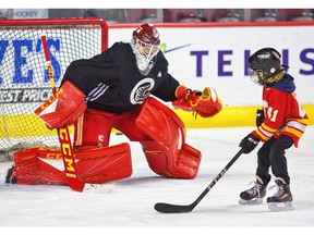 Calgary Flames goalie Mike Smith enjoys a fun skate with his son at the Saddledome in Calgary, on Friday December 21, 2018. Leah Hennel/Postmedia