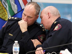Interim police Chief Steve Barlow and deputy chief Paul Cook talk during a Calgary Police Commission meeting on Tuesday, November 27, 2018.