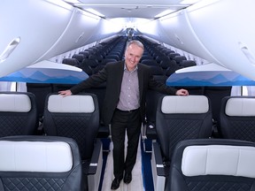 WestJet CEO Ed Sims stands in the cabin of a new Boeing 737 Max 8 in WestJet's Calgary hanger on Thursday December 6, 2018. Gavin Young/Postmedia