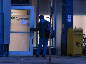 A man enters the Safeworks drug consumption site at the Sheldon M. Chumir Health Centre at dusk on Tuesday December 11, 2018. Gavin Young/Postmedia