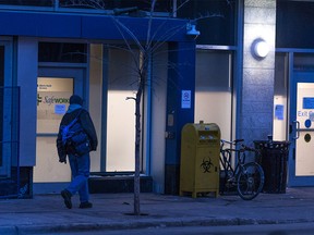 A man enters the Safeworks drug consumption site at the Sheldon M. Chumir Health Centre at dusk on Dec. 11, 2018.