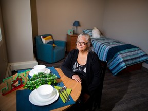 Diane Gautchier with the Calgary Homeless Foundation's Client Action Committee in one of the Maple units. The new apartment building in Regal Terrace provides permanent supportive housing for homeless women in Calgary.