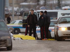 Calgary police investigate a shooting scene that left three people dead after shots were fire inside and outside the Bolsa Vietnamese restaurant at 94th Avenue and Bonaventure Drive SE. STUART DRYDEN Sun Media