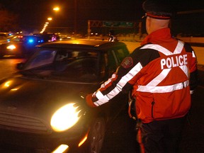 File photo: police conduct a checkstop on Macleod Trail.