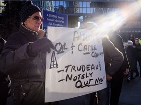 Oil and gas industry supporters gather at a pro-pipeline rally at city hall in Calgary, Alta., Monday, Dec. 17, 2018.THE CANADIAN PRESS/Jeff McIntosh ORG XMIT: JMC104