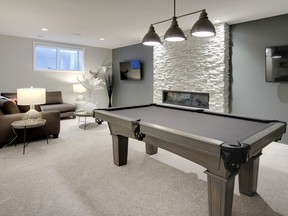 This rec room is warmed by a fireplace, with space for billiards and watching television.