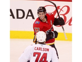 Calgary Flames' Sean Monahan scores on Washington Capitals goalie Philipp Grubauer in third period action at the Scotiabank Saddledome in Calgary on Sunday, October 29, 2017. Darren Makowichuk/Postmedia