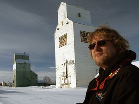 The late Jim Pearson in Stettler in 2011 documenting the town's country grain elevators, which except for one still standing, have been demolished. Photo supplied by Johnnie Bachusky