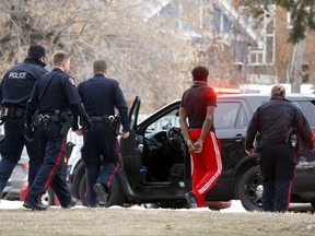 Calgary police investigate a shooting at a condo complex at 15str. and 22nd Ave. S.W. after shots were fired. Police flooded the area taking multiply suspects into custody before clearing the condo units. No one was hurt in the incident in Calgary on Sunday December 23, 2018. Darren Makowichuk/Postmedia