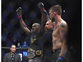 Jon Jones, left, celebrates as the referee raises his arms after Jones defeated Alexander Gustafsson in the UFC men's light heavyweight mixed martial arts bout at UFC 232, Saturday in Inglewood, Calif.