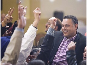 Prab Gill, right, celebrates his byelection win in the Calgary-Greenway riding in Calgary on March 22, 2016.