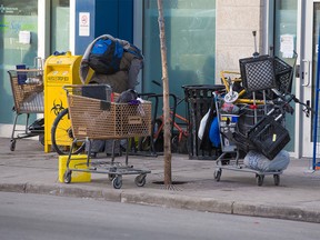 Shopping carts are parked next to a needle drop box outside safe injection site at the Sheldon M. Chumir Health Centre on Tuesday December 11, 2018.  Gavin Young/Postmedia