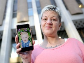 Former Drug Treatment Court client Nicole Hibbert with a picture of her daughter Chloe. Darren Makowichuk/Postmedia