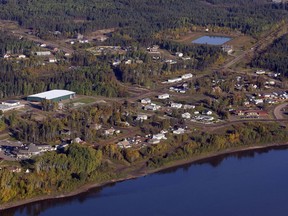 An aerial view of Fort McKay, Alta., Monday, Sept. 19, 2011. An Alberta First Nation is suing the province over development approvals that it says threaten sacred land the government has promised to protect. The Fort McKay First Nation filed the lawsuit in an Edmonton court late last week.