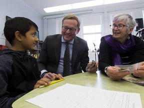 Education Minister David Eggen talks to Grade 4 student, Gauray Singh, 8, left, at Garneau School along with MLA Annie McKitrick prior to making an announcement about the new K-4 curriculum on Friday, Dec. 14, 2018