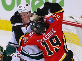 Calgary Flames' Matthew Tkachuk tangles with Minnesota Wild's Ryan Suter at Scotiabank Saddledome in Calgary on Thursday, Dec. 6, 2018. Gavin Young/Postmedia