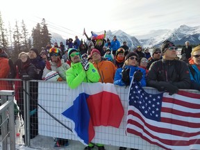 The crowd assembled around the finish corral happily cheered on all nations during day 2 of downhill races at the Lake Louise Audi FIS Ski World Cup on Saturday. Photo by Patrick Gibson/Postmedia Network
