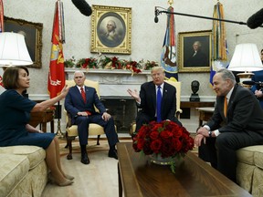 House Minority Leader Rep. Nancy Pelosi, D-Calif., Vice President Mike Pence, President Donald Trump, and Senate Minority Leader Chuck Schumer, D-N.Y., argue during a meeting in the Oval Office of the White House, Tuesday, Dec. 11, 2018, in Washington.
