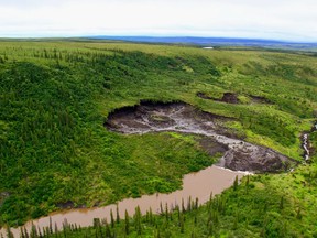 A thaw slump in the Northwest Territories that three University of Alberta students visited to measure the amount of mercury being released into waterways as a result of the thawing permafrost.