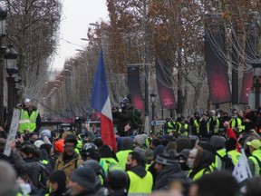 'Yellow Vest' protestors gather for the fourth consecutive weekend on the Champs-Elysees in Paris.