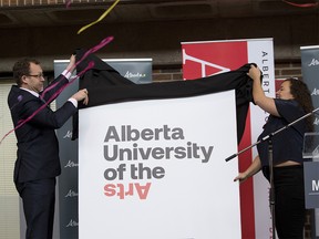 Marlin Schmidt, Minister of Advanced Education, left and Simone Saunders, student, Alberta College of Art + Design reveal the new name for the art school now known as Alberta University of the Arts in Calgary, on Thursday Jan. 17, 2019.
