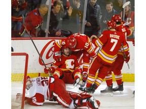 Calgary Flames Sam Bennett celebrates his goal on Detroit Red Wings goalie Jimmy Howard with teammates in NHL hockey action at the Scotiabank Saddledome in Calgary, Alta. on Friday January 18, 2019. Leah Hennel/Postmedia