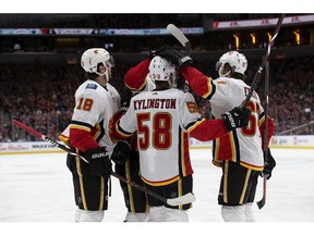 The Calgary Flames celebrate Oliver Kylington's (58) goal during second period NHL action against the Edmonton Oilers at Rogers Place, in Edmonton Saturday Jan. 19, 2019. Photo by David Bloom