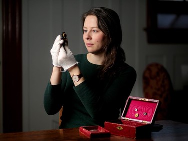 Lougheed House curator Caroline Loewen gets a box of mementos belonging to Clarence Lougheed ready for display in the new national First World War exhibit at the Lougheed House in Calgary, on Tuesday January 22, 2019. Leah Hennel/Postmedia