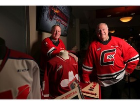 The early 70's Centennials players Mike Rogers, left and Jerry Holland represent two-thirds of what was arguably the best line ever in Calgary hockey. Photo by Leah Hennel/Postmedia.