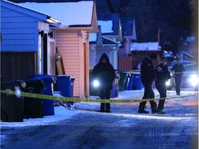 Police investigate in an alley behind the 100 block of 15 Street N.W. in Hillhurst after an overnight shooting death on Tuesday January 22, 2019.  Gavin Young/Postmedia