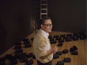 Steven Nunoda, a Calgary-based artist, prepares his "Ghostown" installation at the Royal Ontario Museum in Toronto on Tuesday, January 29, 2019.