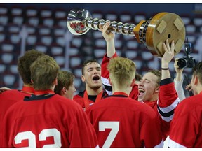 The St. Albert Raiders celebrate after winning the Mac's AAA Midget hockey final at the Scotiabank Saddledome in Calgary on Tuesday, January 1, 2019. Al Charest/Postmedia