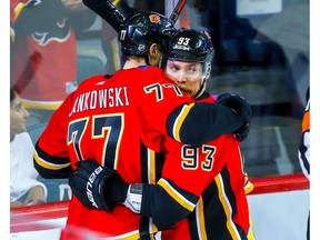 Calgary Flames Mark Jankowski celebrates with teammate Sam Bennett after scoring against the Colorado Avalanche in NHL hockey at the Scotiabank Saddledome in Calgary on Wednesday. Photo by Al Charest/Postmedia.